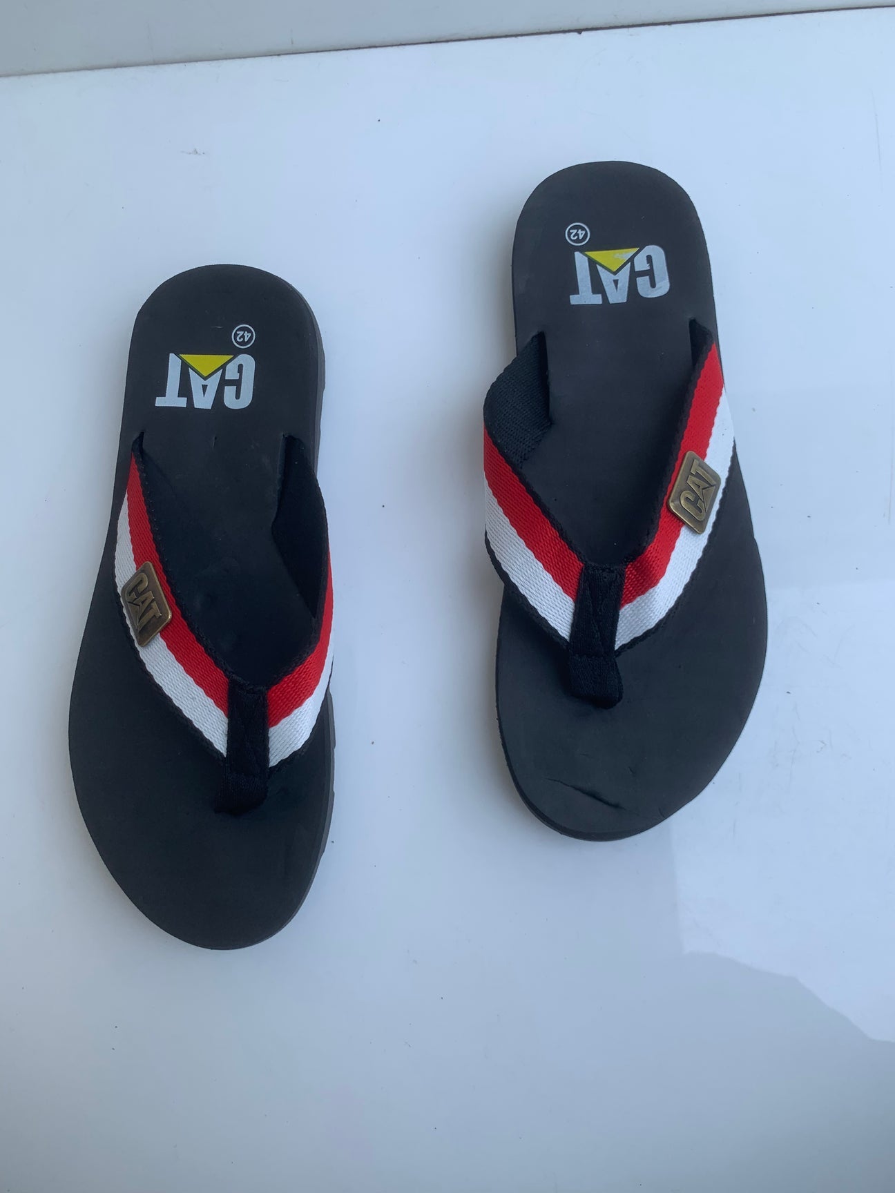Imported Black C-A-T Flip Flop