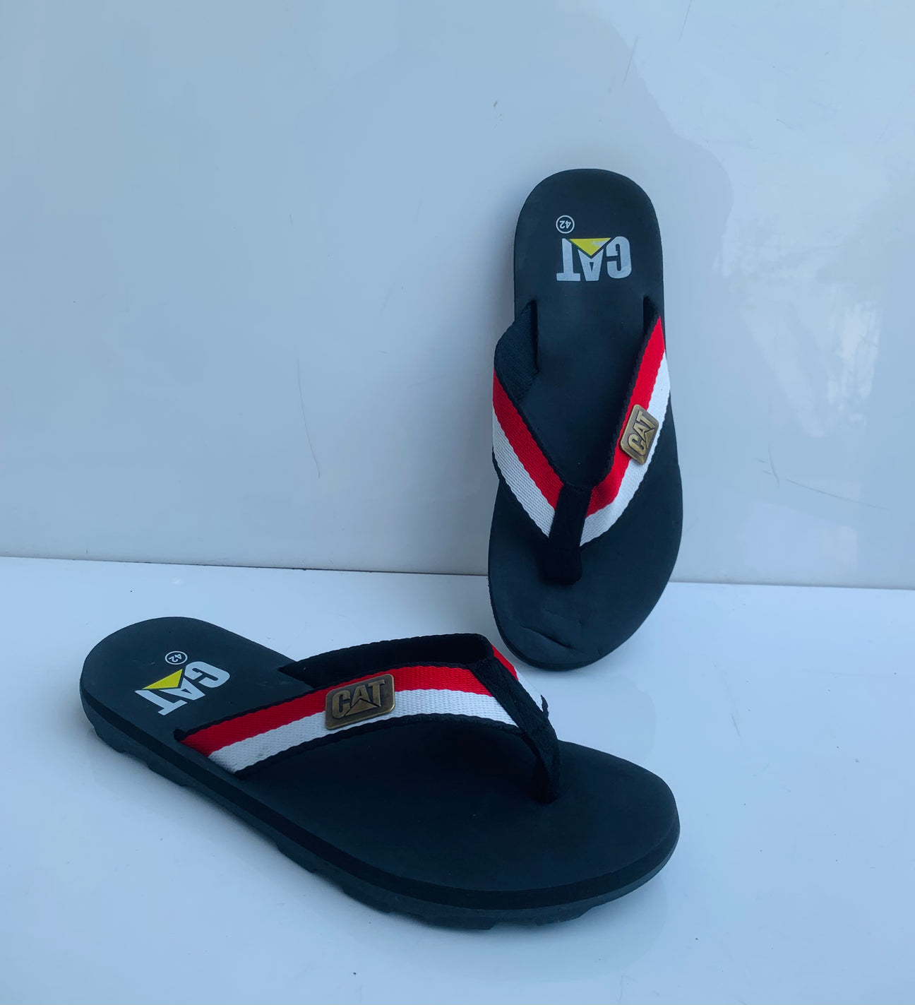 Imported Black C-A-T Flip Flop